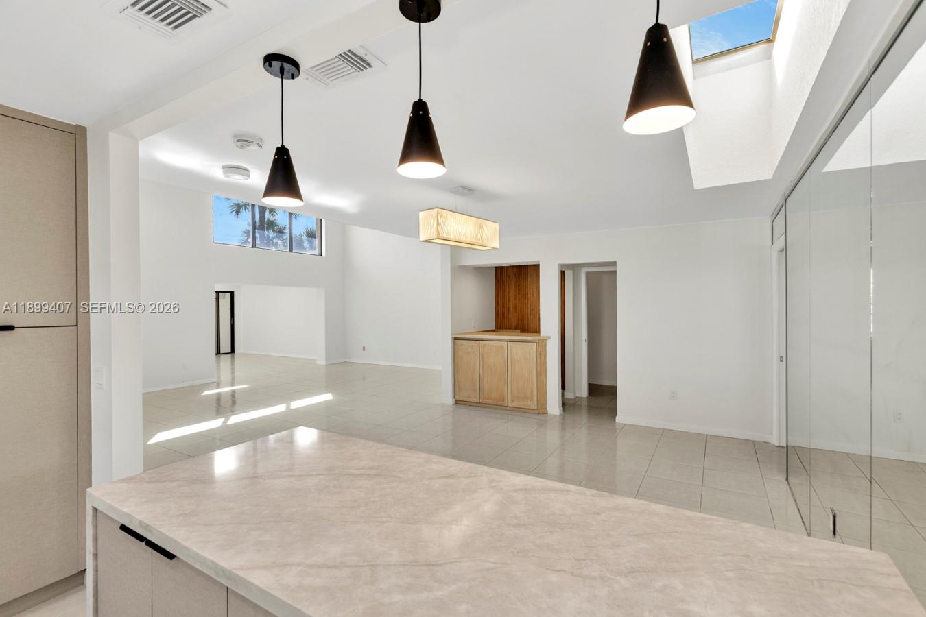 21686 Arriba Real, Unit 40A Boca Raton, FL 33433 - Photo 16 of 53 a kitchen with stainless steel appliances granite countertop a sink and a refrigerator