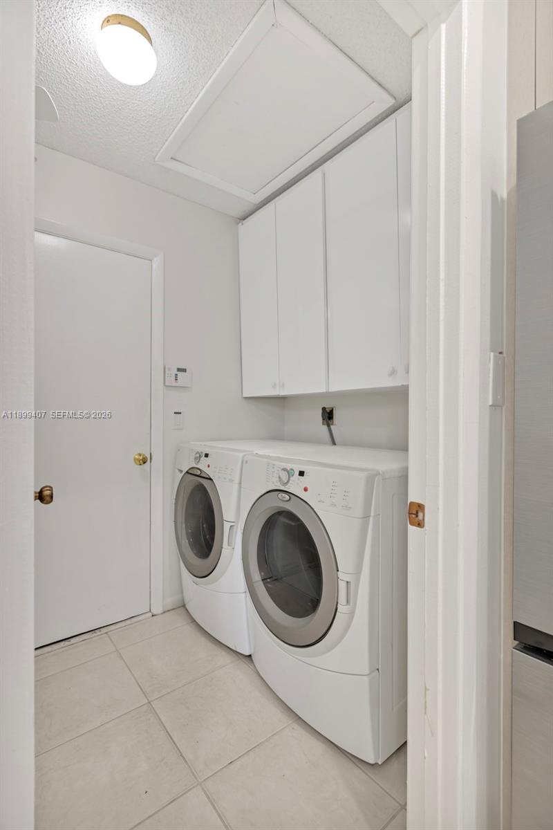 21686 Arriba Real, Unit 40A Boca Raton, FL 33433 - Photo 19 of 53 a utility room with dryer and washer