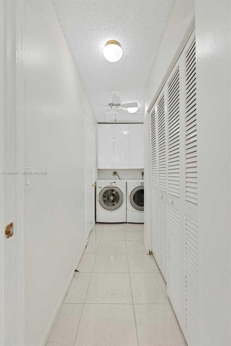 21686 Arriba Real, Unit 40A Boca Raton, FL 33433 - Photo 20 of 53 a utility room with dryer and washer