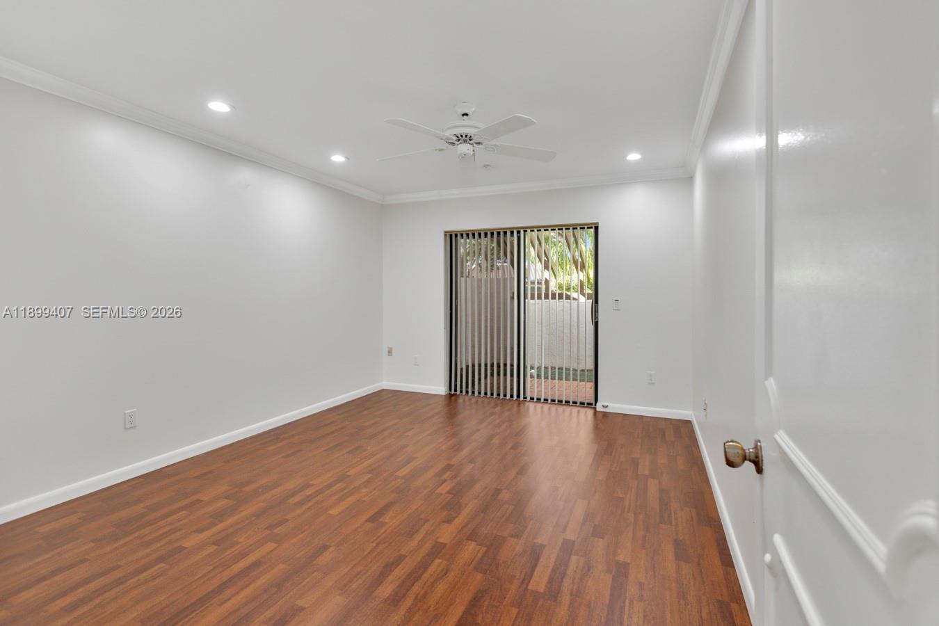 21686 Arriba Real, Unit 40A Boca Raton, FL 33433 - Photo 24 of 53 wooden floor in an empty room with a window