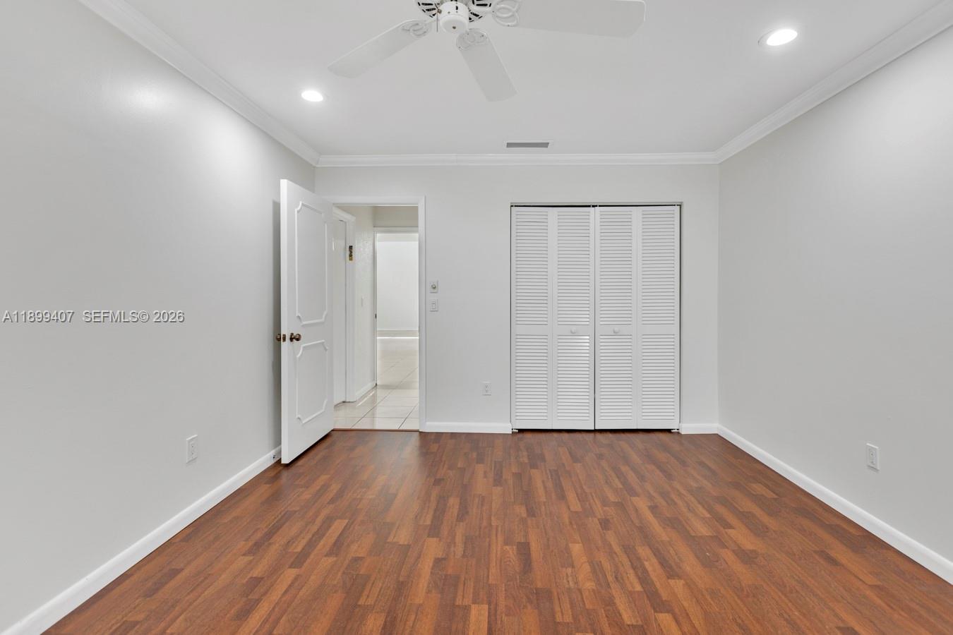 21686 Arriba Real, Unit 40A Boca Raton, FL 33433 - Photo 25 of 53 wooden floor in an empty room with a window