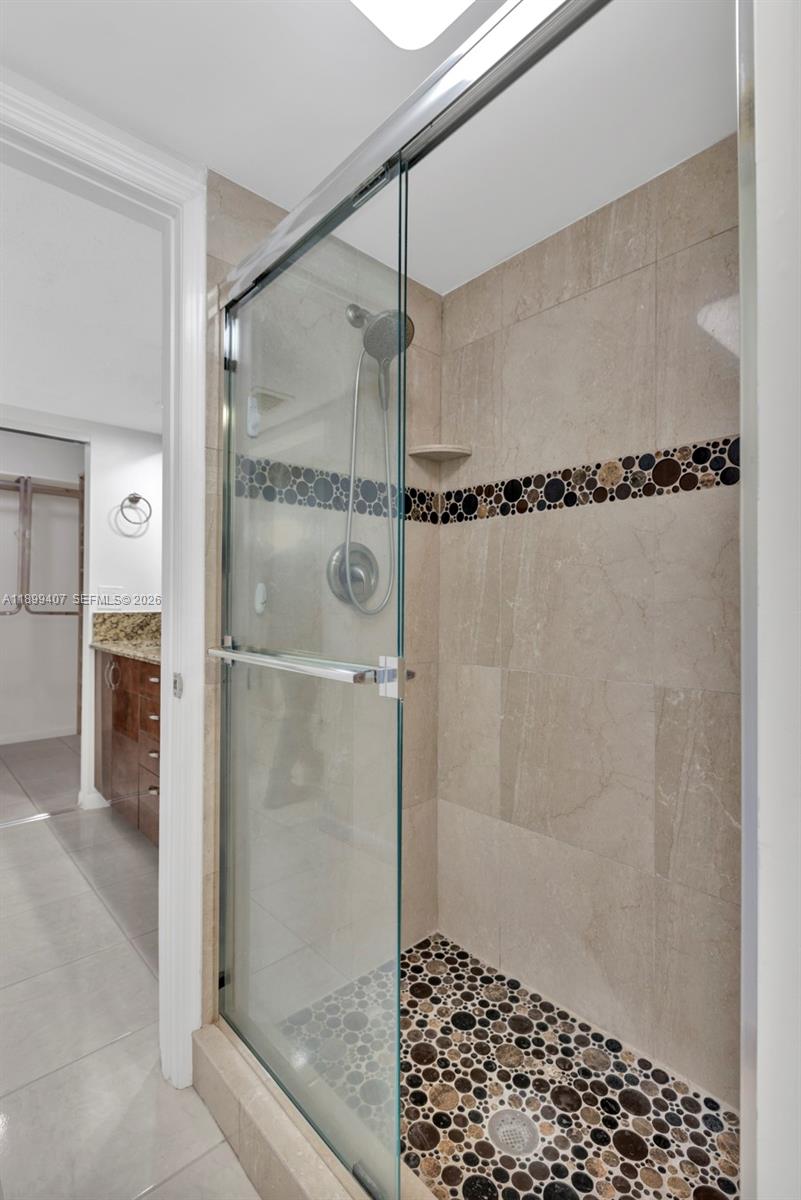 21686 Arriba Real, Unit 40A Boca Raton, FL 33433 - Photo 36 of 53 a bathroom with a shower and a sink