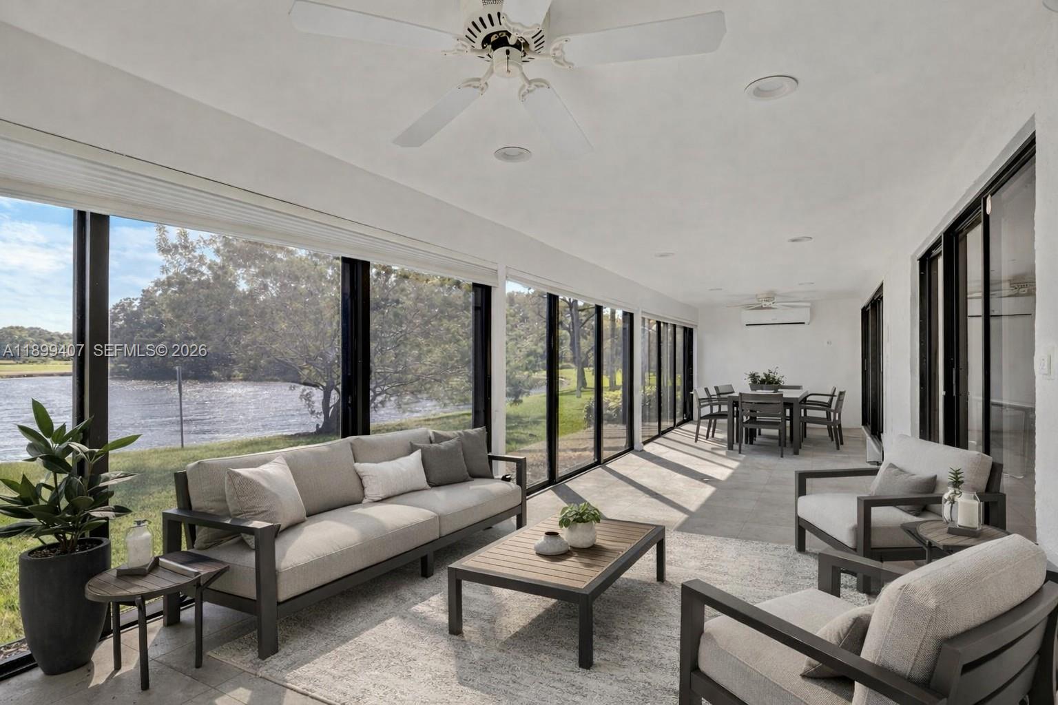 21686 Arriba Real, Unit 40A Boca Raton, FL 33433 - Photo 40 of 53 a living room with furniture and a large window