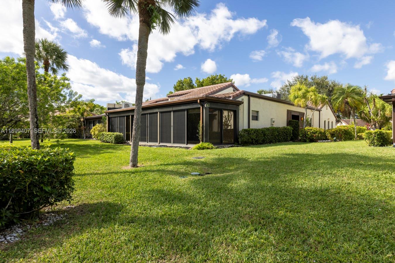 21686 Arriba Real, Unit 40A Boca Raton, FL 33433 - Photo 47 of 53 a view of a house with a yard