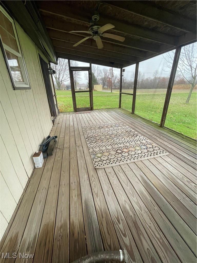 9945 Quarry Road Amherst, OH 44001 - Photo 27 of 30 Unfurnished sunroom featuring beam ceiling and ceiling fan