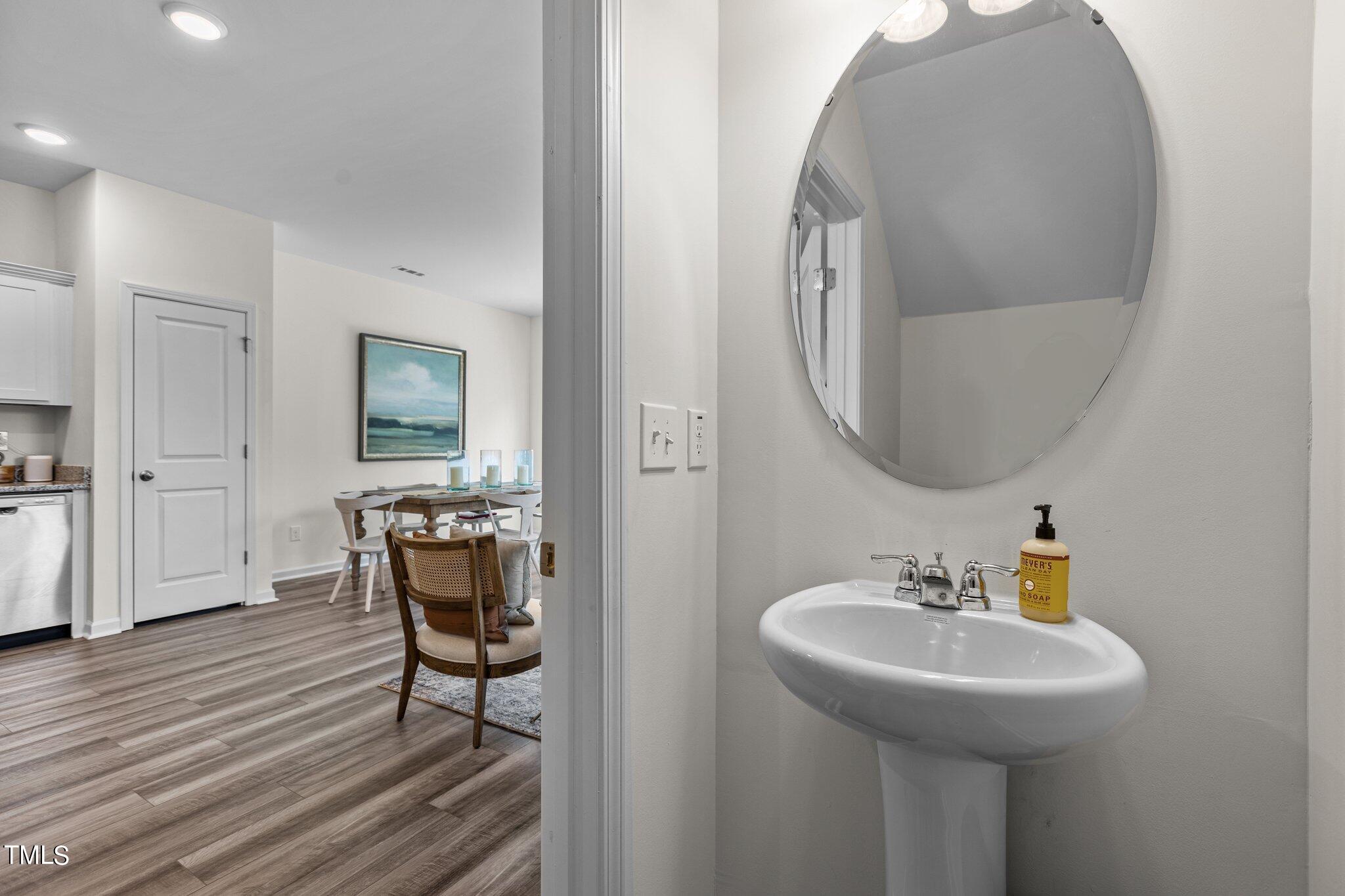 130 South Chubb Ridge Clayton, NC 27520 - Photo 18 of 32 a bathroom with a sink and a mirror