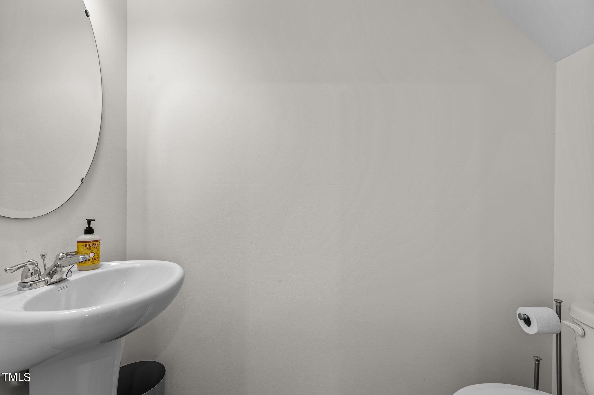 130 South Chubb Ridge Clayton, NC 27520 - Photo 19 of 32 a bathroom with a sink mirror and toilet