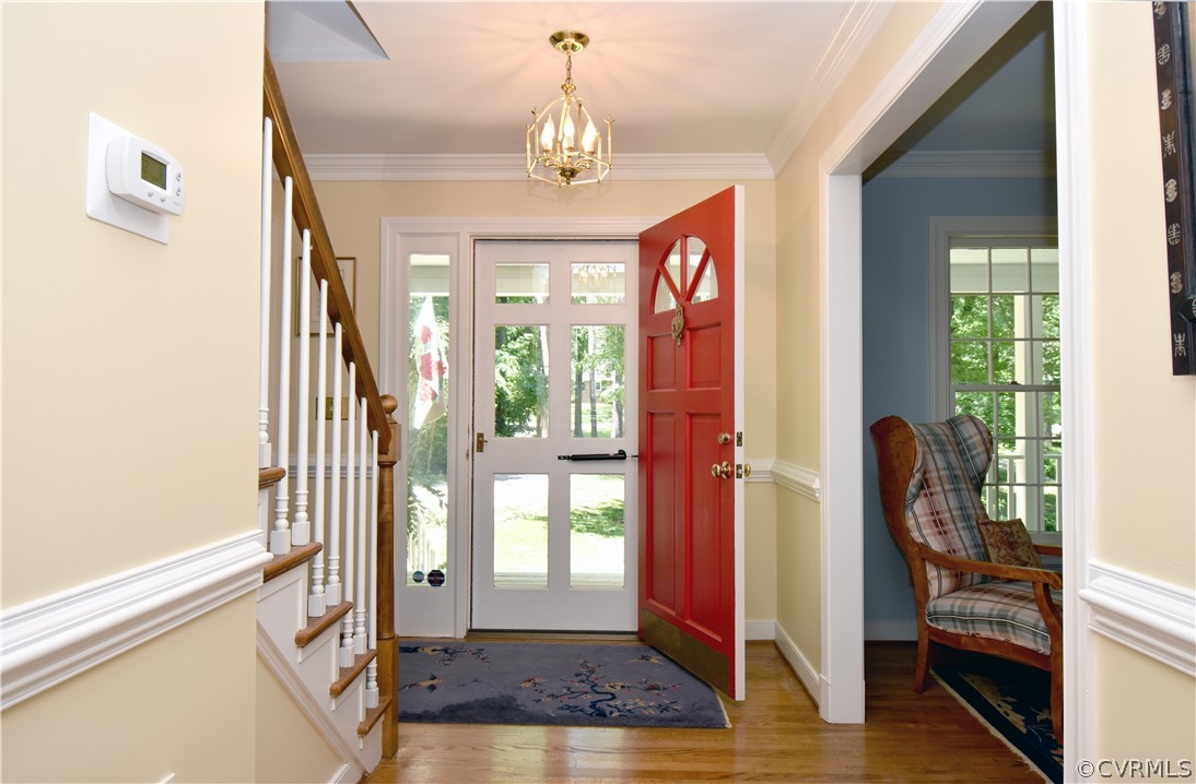 8331 Cherokee Road Richmond, VA 23235 - Photo 4 of 47 a view of a hallway with wooden floor and stairs