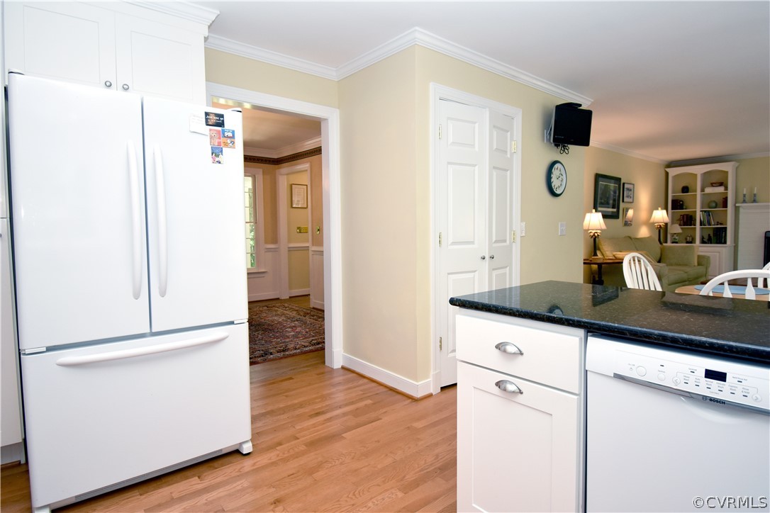 8331 Cherokee Road Richmond, VA 23235 - Photo 9 of 47 a kitchen with a refrigerator and cabinets