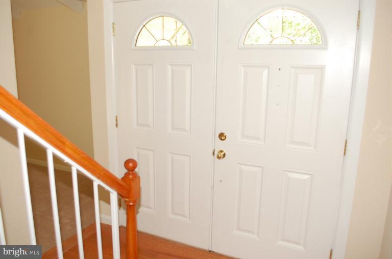 6216 Stevens Forest Road Columbia, MD 21045 - Photo 21 of 30 a view of front door with hallway