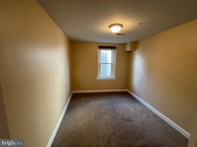 an empty room with a bathroom
