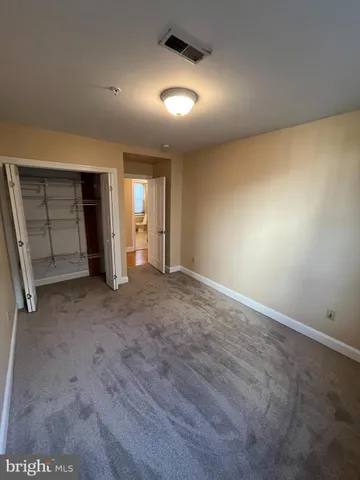 a bathroom with a sink vanity and mirror
