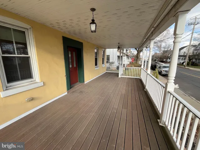 a view of a balcony with wooden floor