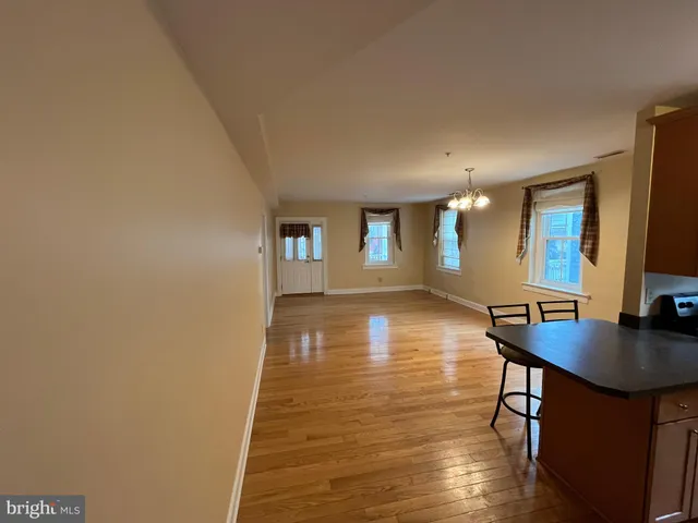 a view of a livingroom with furniture and wooden floor