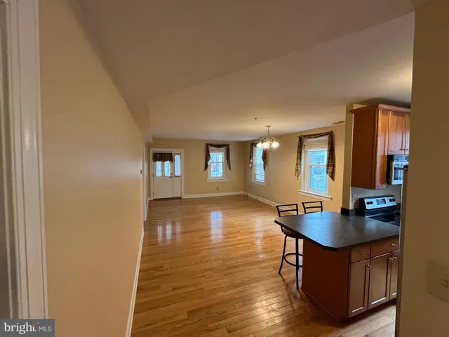 a workspace with wooden floor and a bathroom