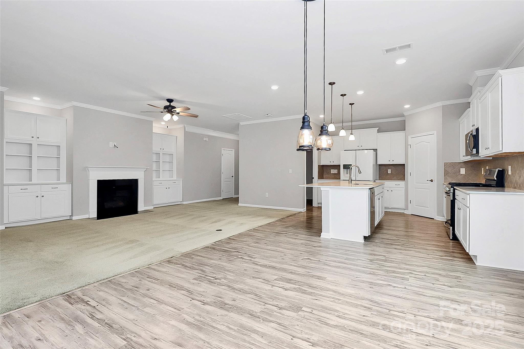 5149 Samoa Ridge Drive Lancaster, SC 29720 - Photo 21 of 40 a view of a kitchen with a sink stove cabinets and stainless steel appliances