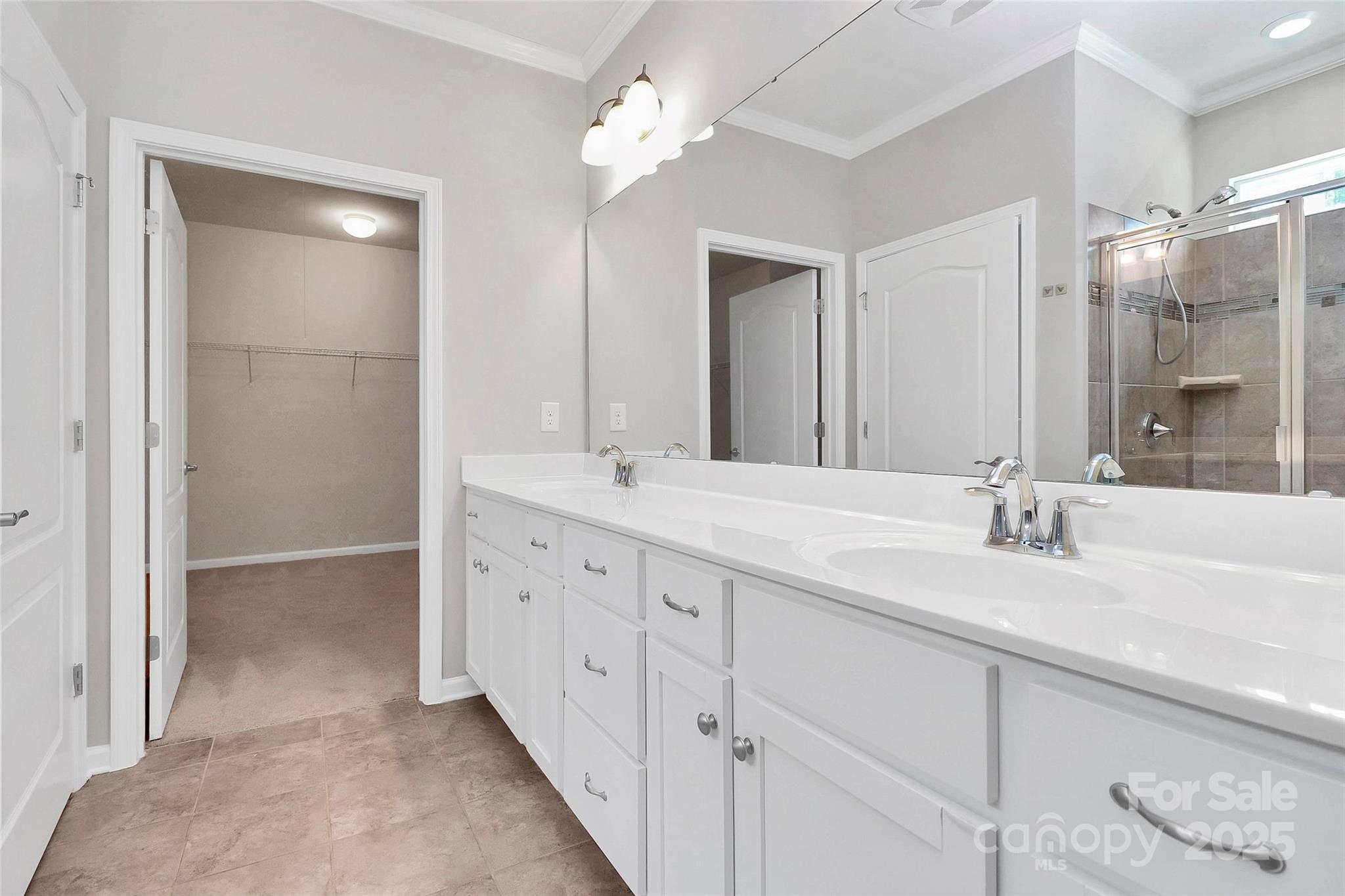 5149 Samoa Ridge Drive Lancaster, SC 29720 - Photo 29 of 40 a bathroom with double vanity sink and a mirror