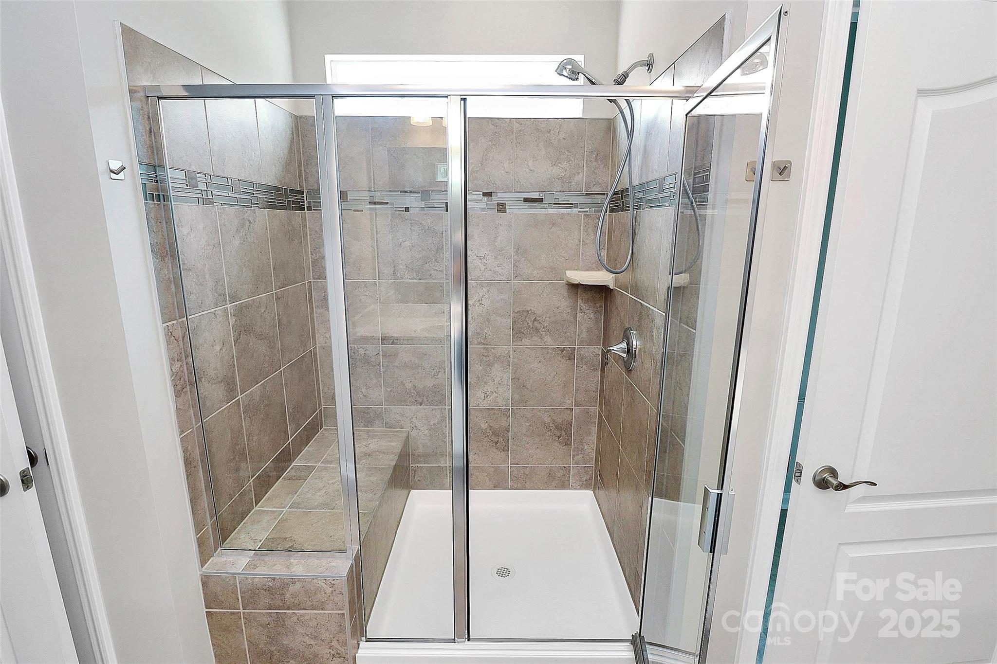 5149 Samoa Ridge Drive Lancaster, SC 29720 - Photo 30 of 40 a bathroom with a glass shower door and a sink