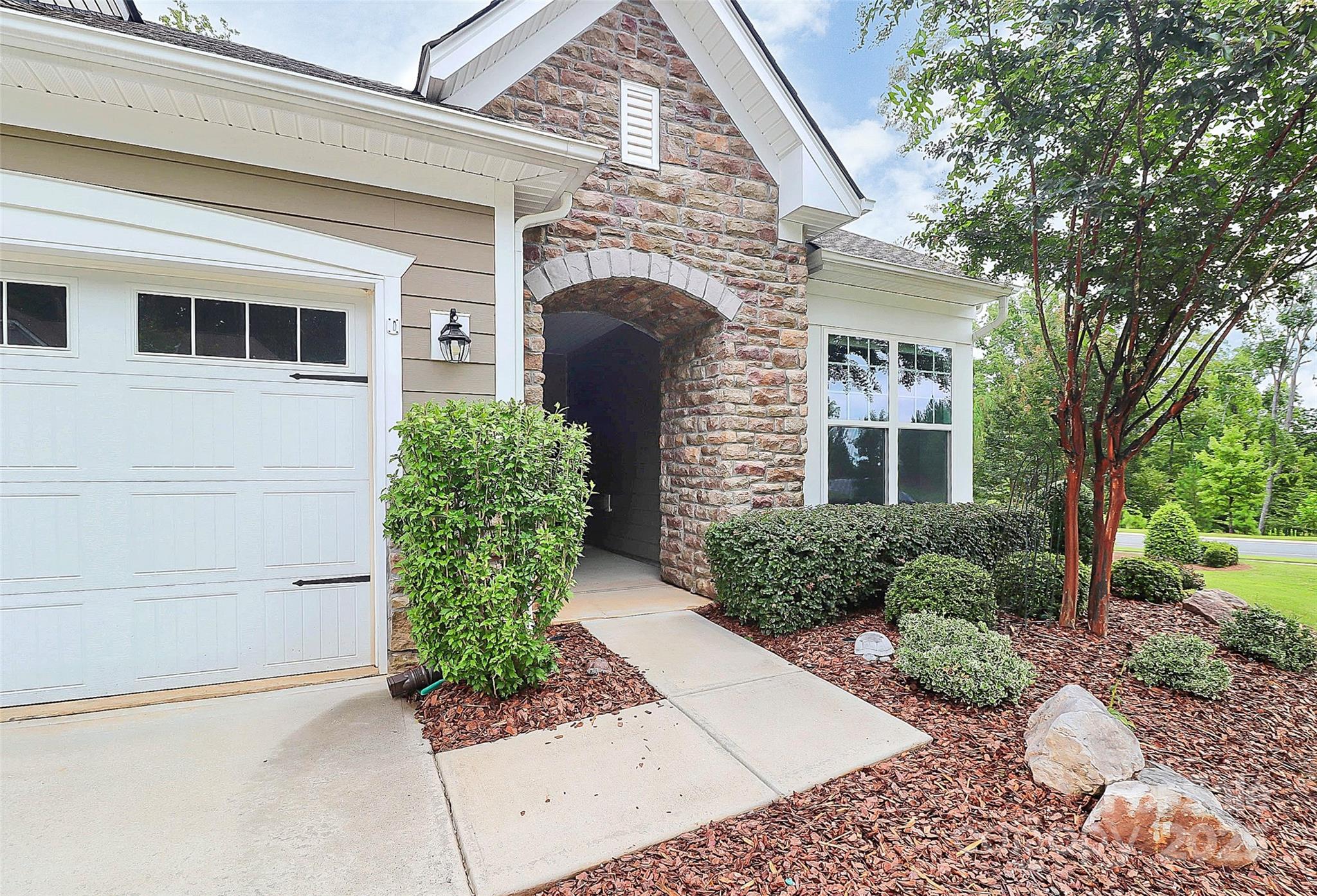5149 Samoa Ridge Drive Lancaster, SC 29720 - Photo 4 of 40 a front view of a house with garden