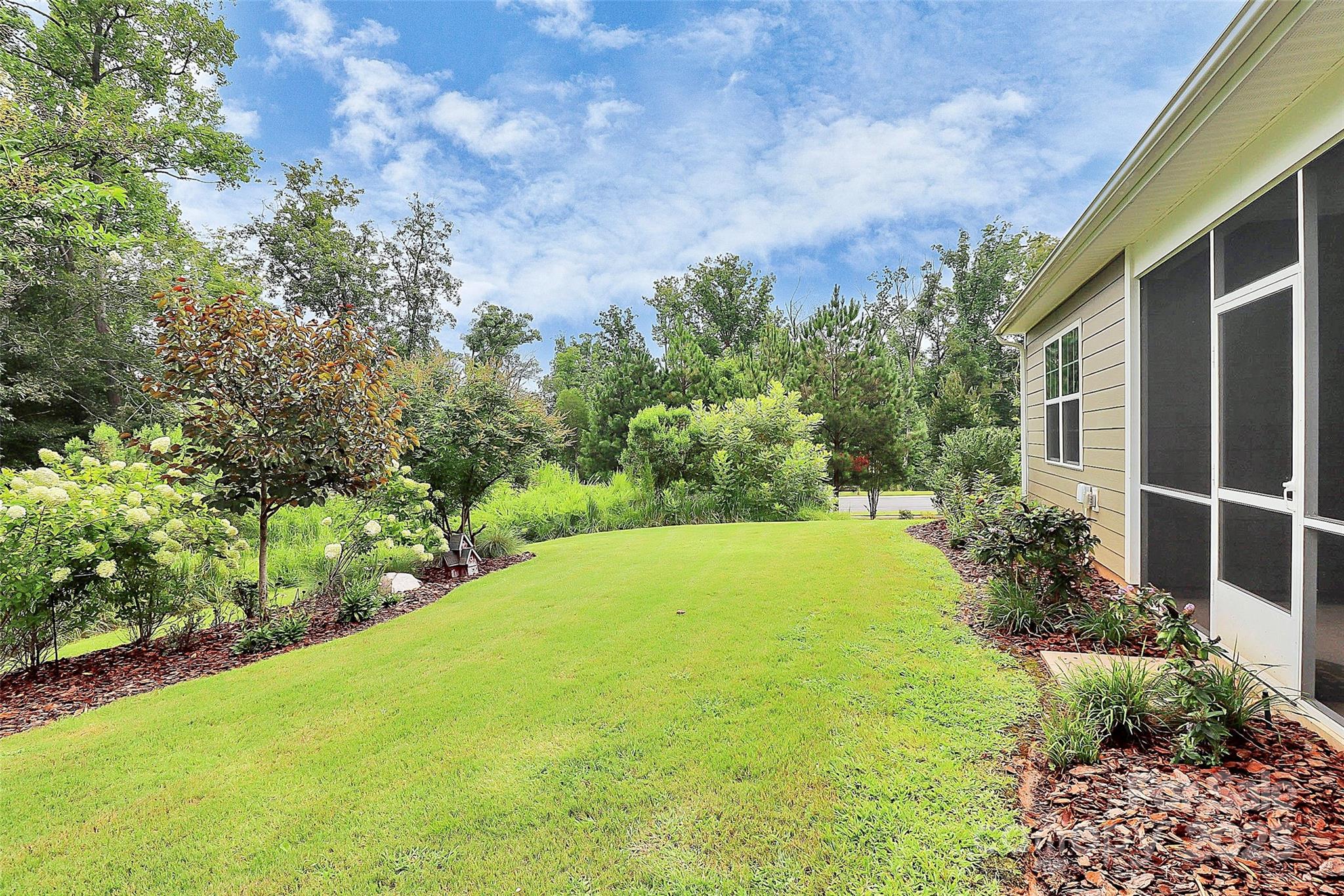 5149 Samoa Ridge Drive Lancaster, SC 29720 - Photo 5 of 40 a view of a yard with an tree and plants