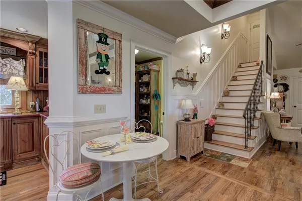 a kitchen with a sink cabinets and wooden floor