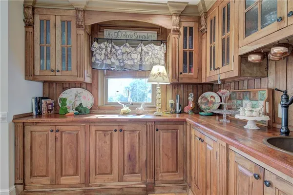 a view of a dining room with furniture and a chandelier