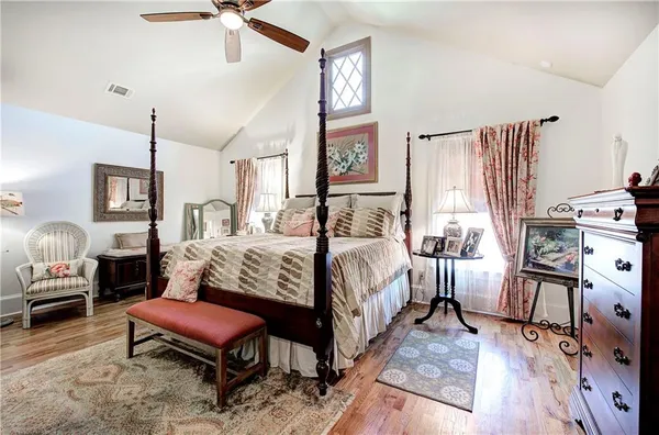 a bedroom with a bed and a walk in closet