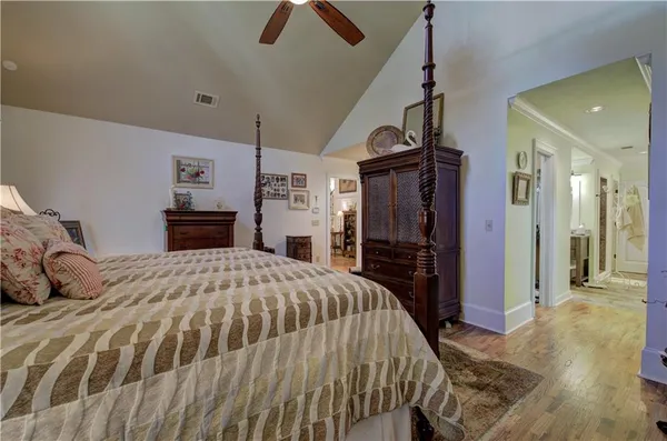 a bed room with furniture and a chair