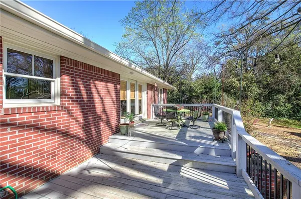 a view of outdoor space with deck and barbeque oven