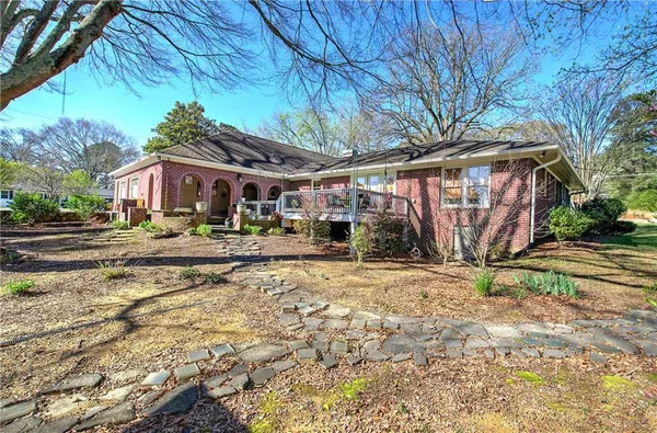 a view of house with yard