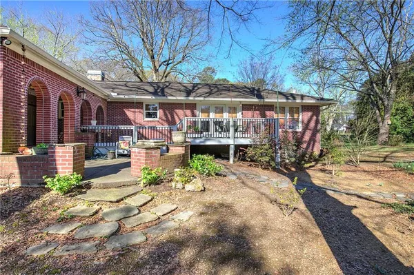 a view of a house with a yard and garage