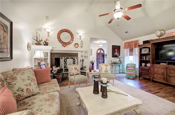 a view of a hallway with a white walls and a window