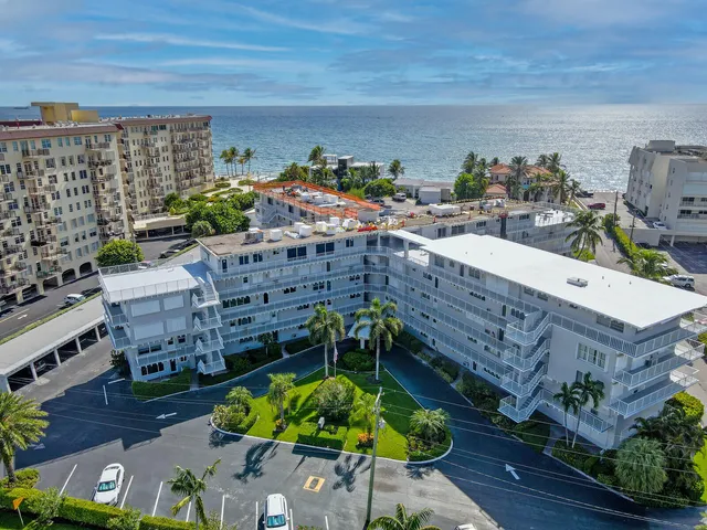 a view of a balcony with two chairs and a table