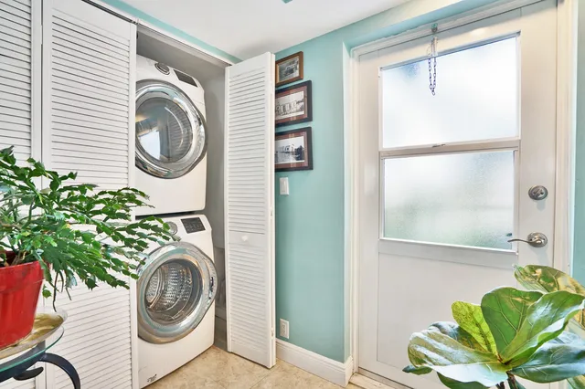 a bathroom with a sink and a washer dryer