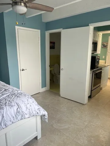 a bedroom with a bed and a sink