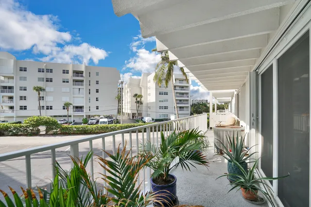 a view of balcony with furniture