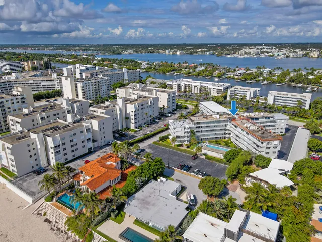 an aerial view of a houses with a swimming pool