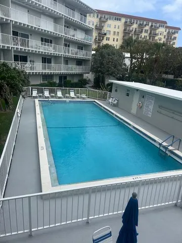 a view of balcony with furniture