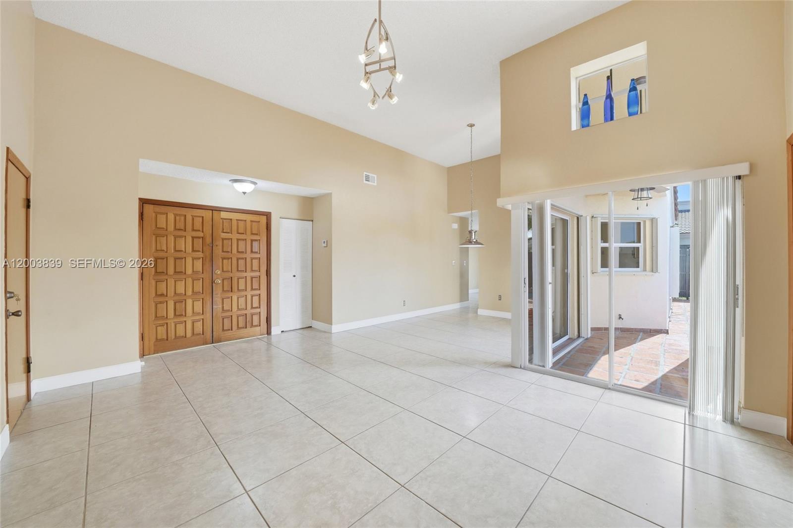 631 Southwest 88th Court Miami, FL 33174 - Photo 11 of 28 a view of an empty room with glass door