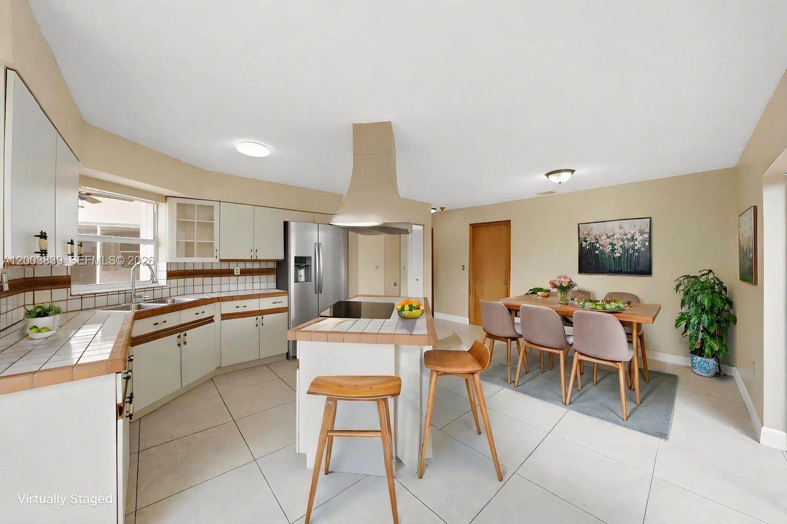 631 Southwest 88th Court Miami, FL 33174 - Photo 13 of 28 a very nice looking open dining room with kitchen island