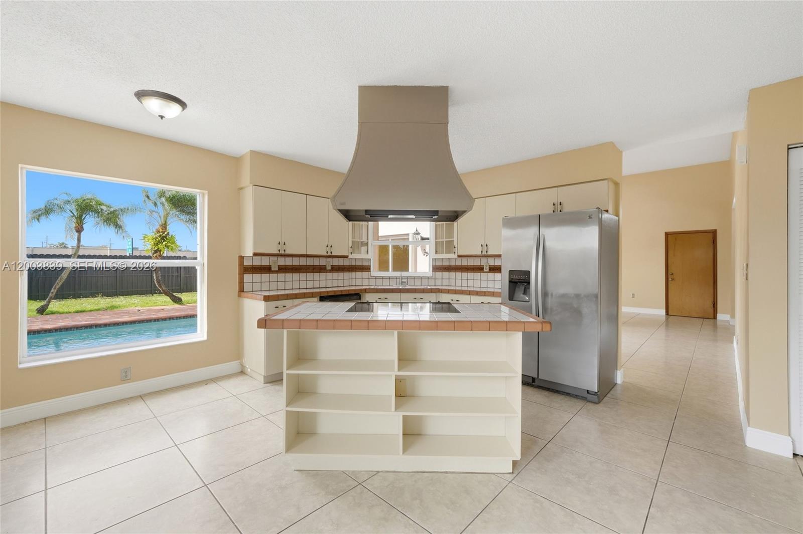 631 Southwest 88th Court Miami, FL 33174 - Photo 15 of 28 a kitchen with stainless steel appliances a refrigerator and a stove