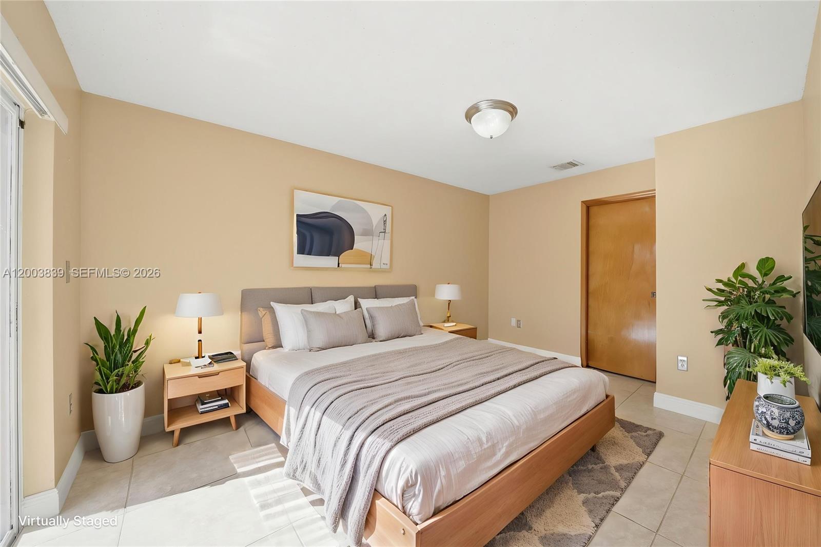 631 Southwest 88th Court Miami, FL 33174 - Photo 19 of 28 a bedroom with a bed and potted plant