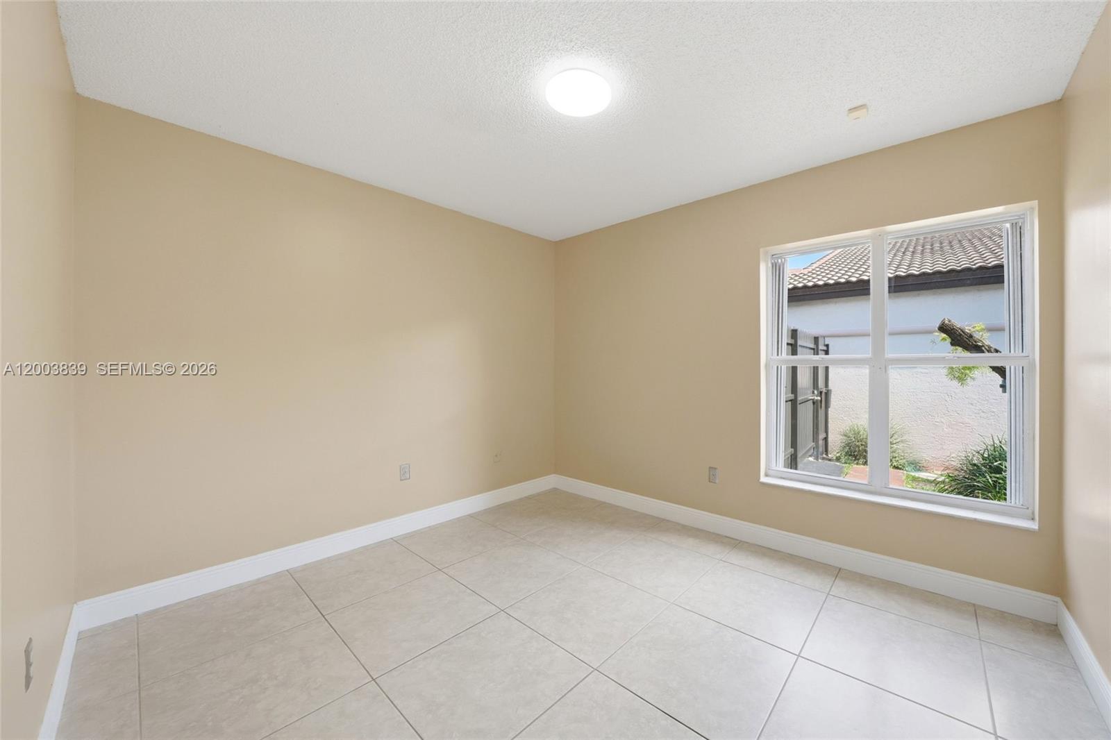 631 Southwest 88th Court Miami, FL 33174 - Photo 27 of 28 an empty room with a window