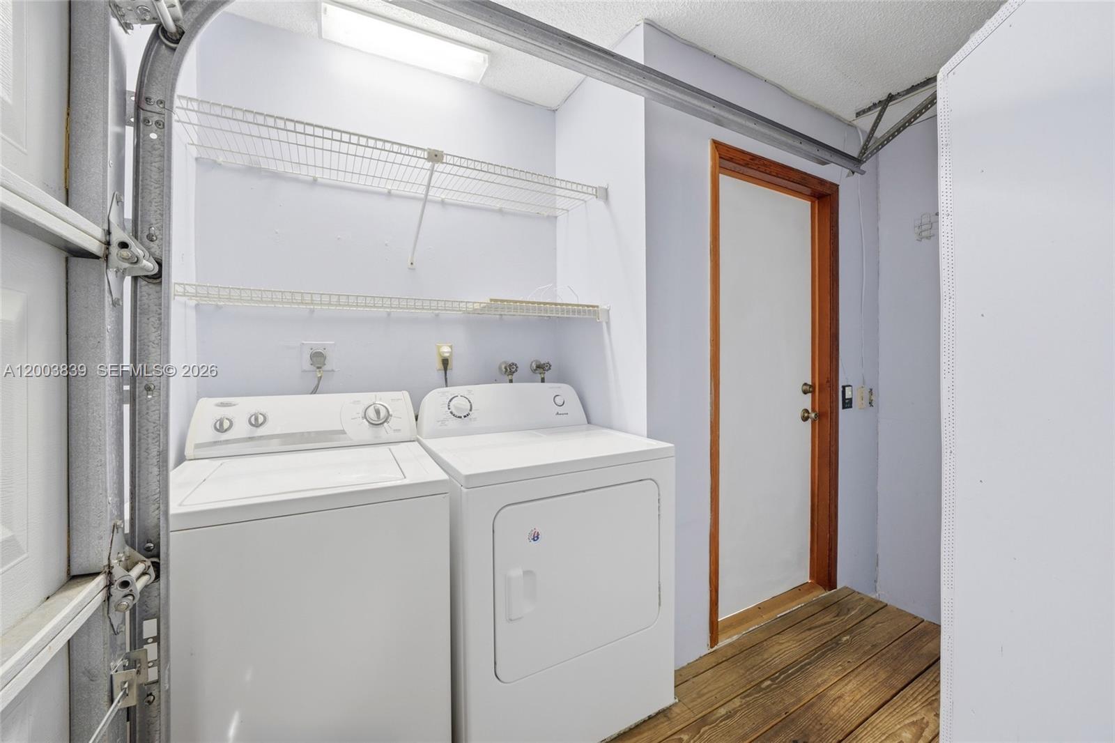 631 Southwest 88th Court Miami, FL 33174 - Photo 28 of 28 a utility room with dryer and washer