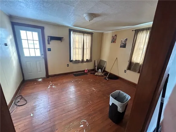 a kitchen with refrigerator and window