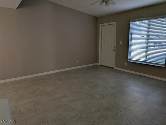 a white toilet sitting next to a bath tub