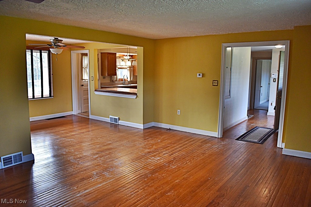17600 Egbert Road Bedford, OH 44146 - Photo 13 of 49 Another view of the large open Living Room / Dining Room and entrance Foyer.