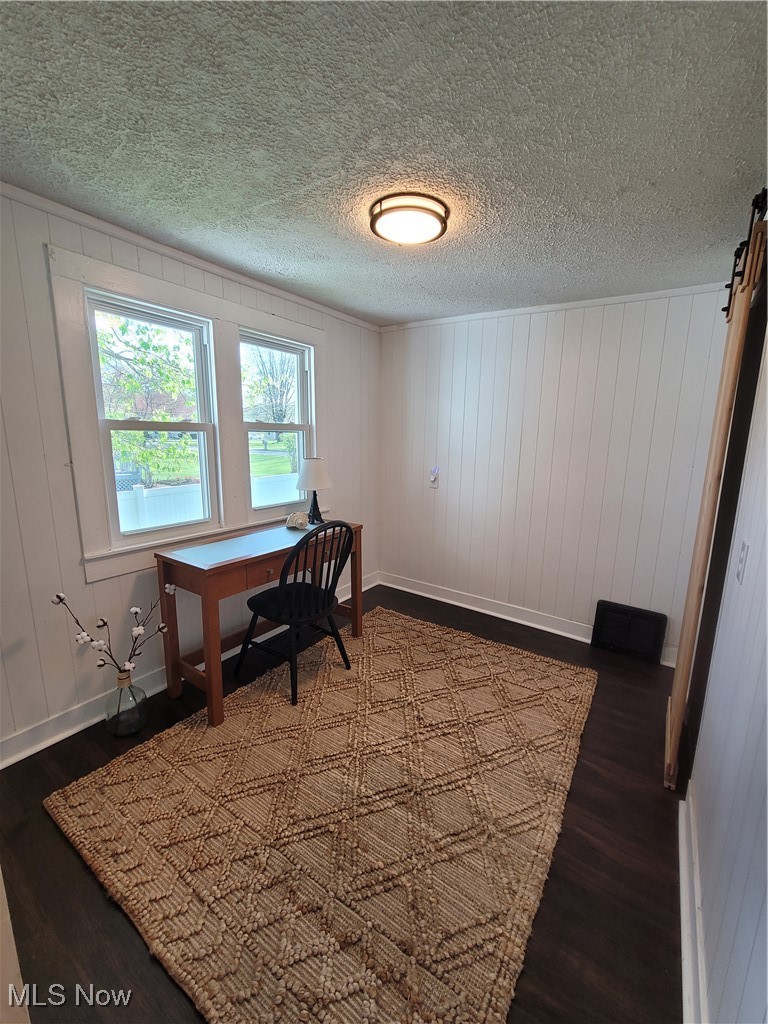 2311 Stillwagon Road Southeast Warren, OH 44484 - Photo 15 of 35 Home office with baseboards, dark wood-style flooring, and a textured ceiling