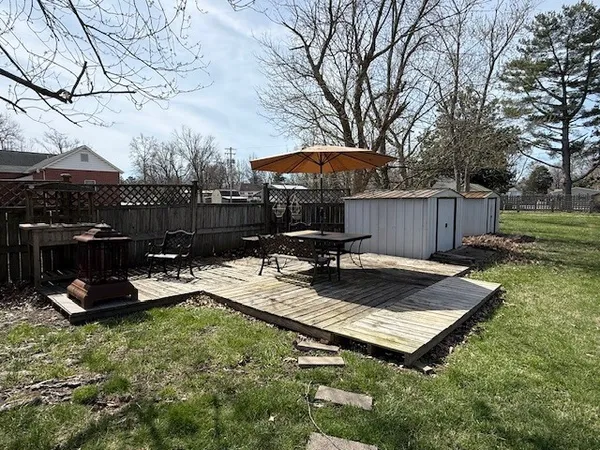 a view of a backyard with sitting area