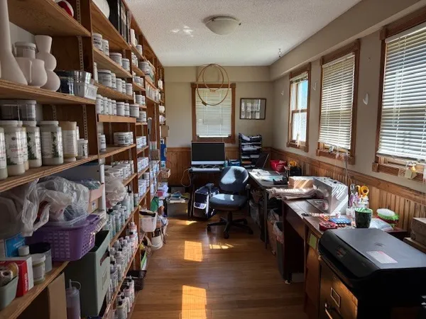 a living room with lots of furniture and a window